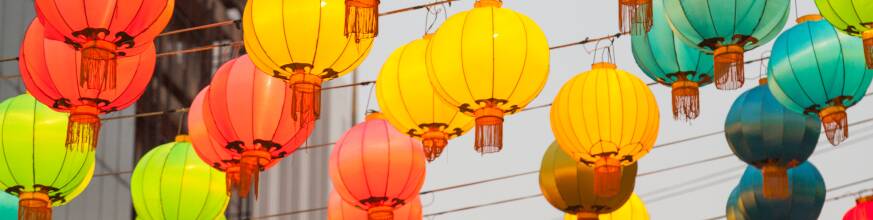 Colorful traditional Chinese lanterns hanging outdoors during a festival