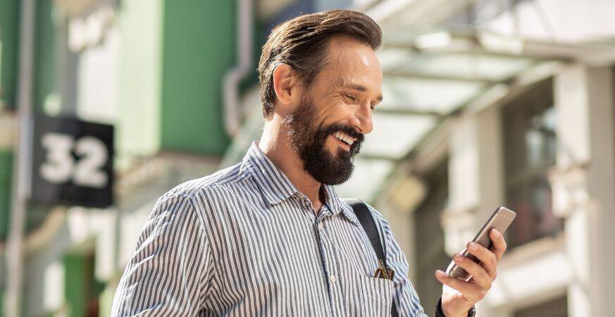 man looking at his phone